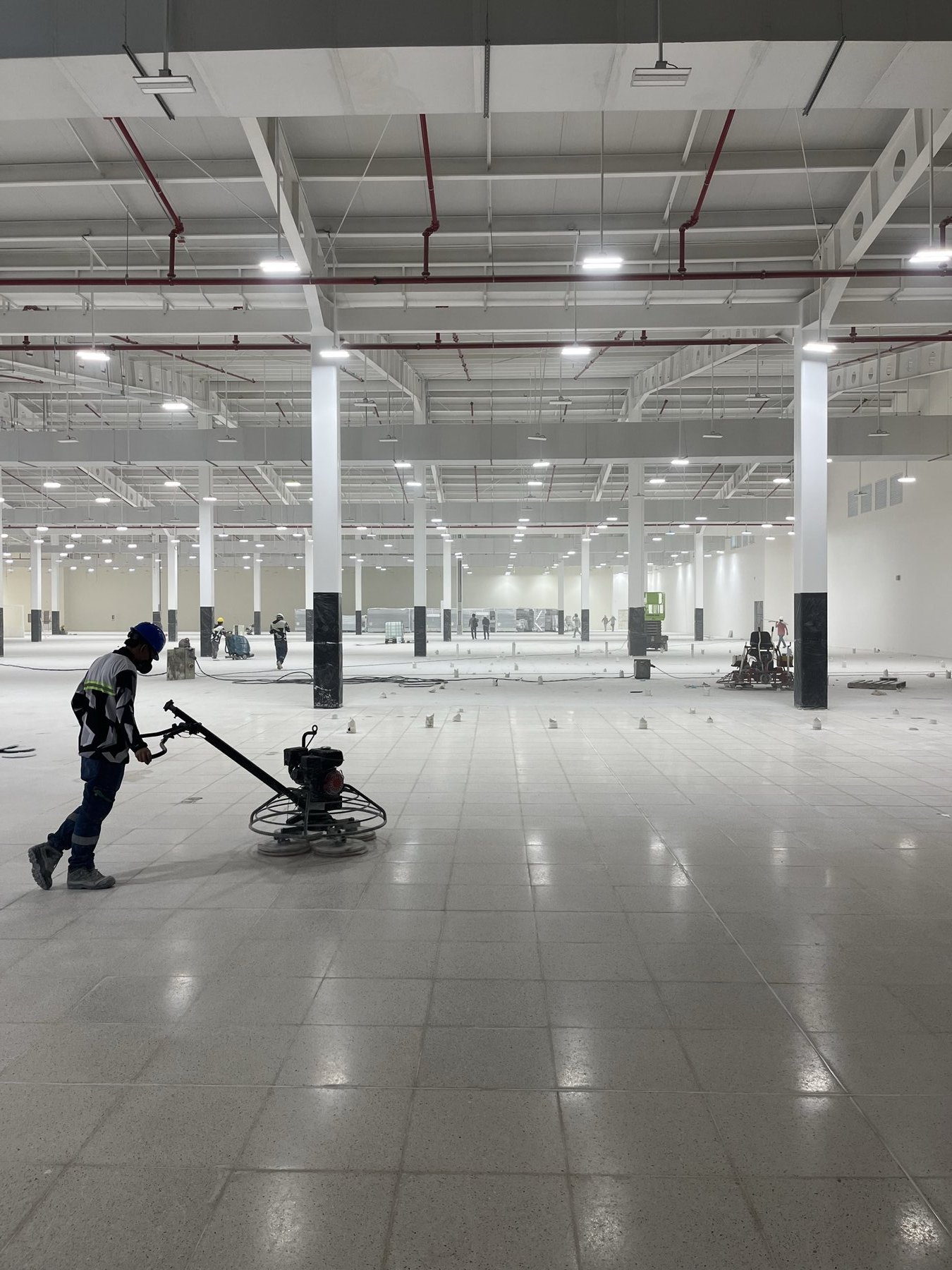 BAEC crew polishing a terrazzo floor on site